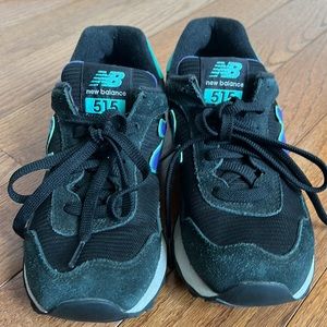 Gently used New Balance 515 women's sneakers. Black, real and purple.